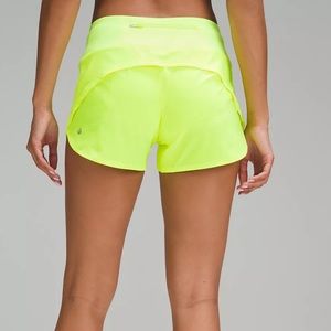 Light neon sports shorts layered